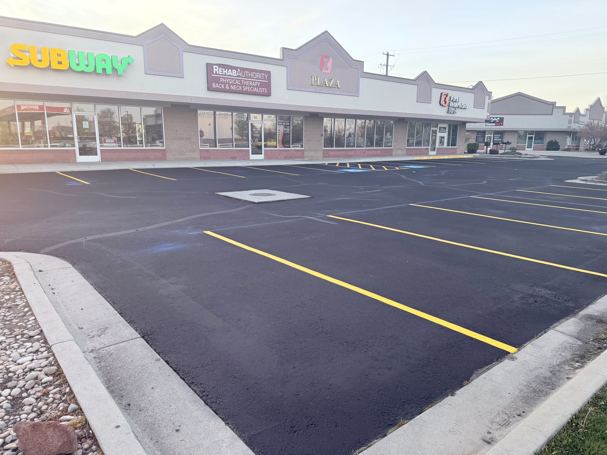 Subway and H&R Block plaza with fresh striping